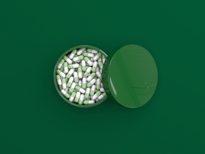 Ayurvedic medicine green pills in green container