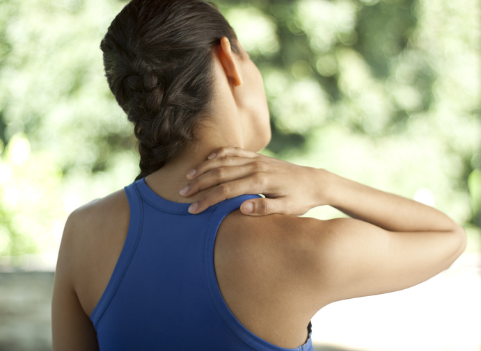 Woman in sportswear with neck pain
