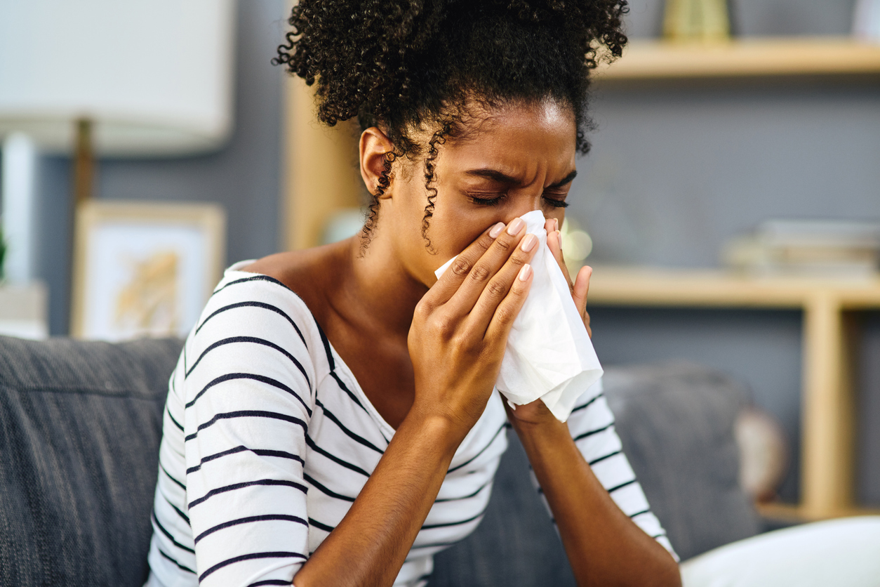 Woman sneezing